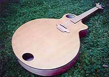 The spruce ply top looks like a bookmatched four piece top, albeit with obvious glue lines.