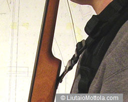 The second strap attaches to the strap button on the back of the body...